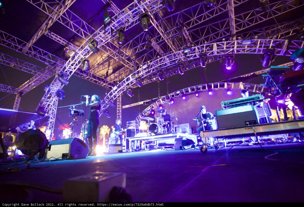 Purple Spotlight on the Concert Crowd