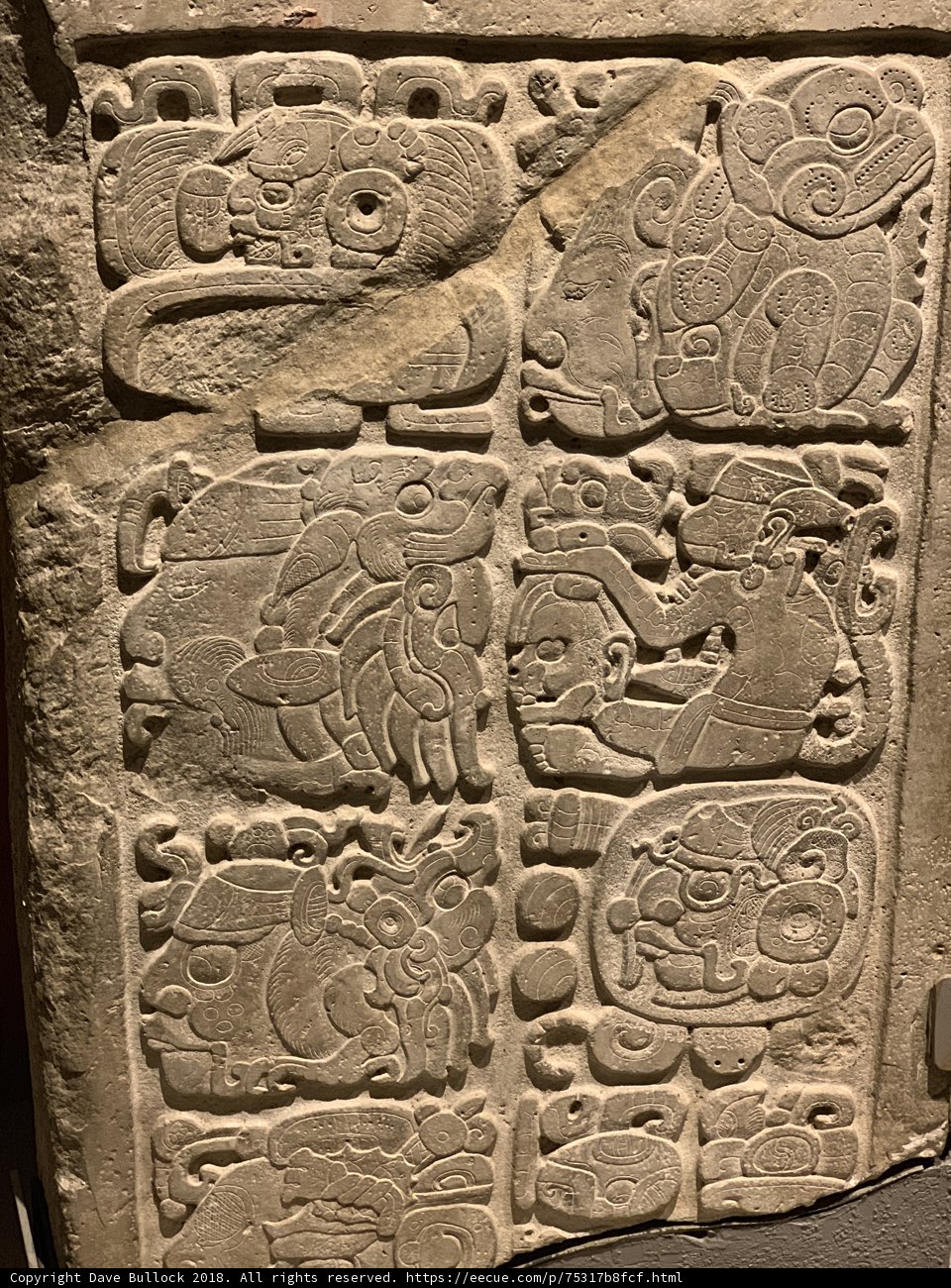 Ancient Stone Carving Depicting Animals and People