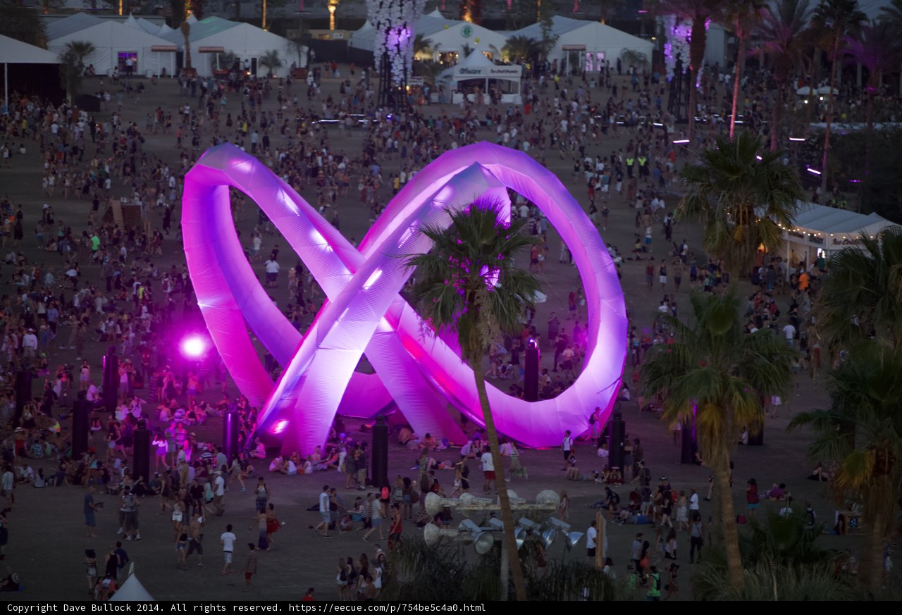 Majestic Purple Sculpture among a Sea of People