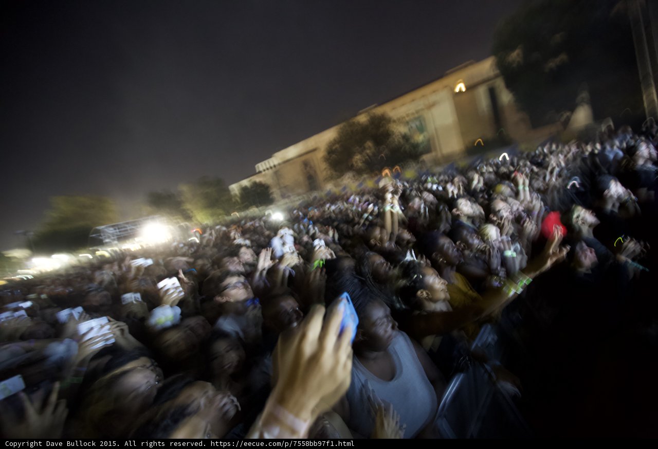 FYF Fest Massive Crowd Motion Blur Night Phones Recording Stage Lights Building Woman Gray Tank