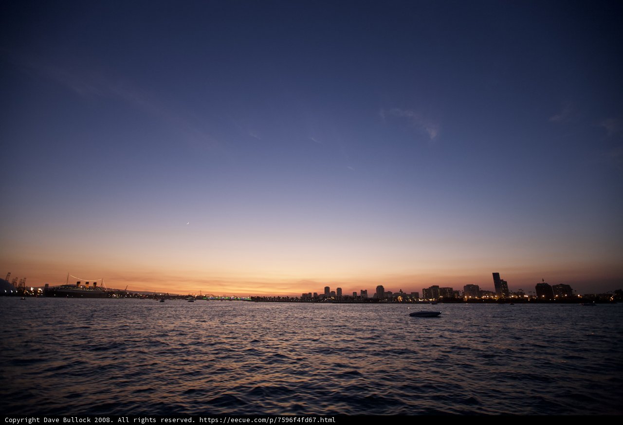 Sunset Cityscape with Boats on the Water