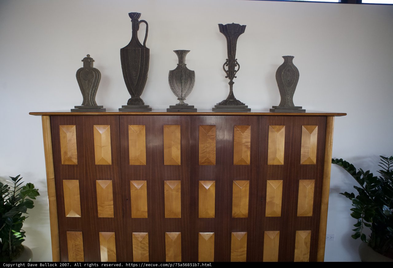 The Wooden Cabinet with Four Vases