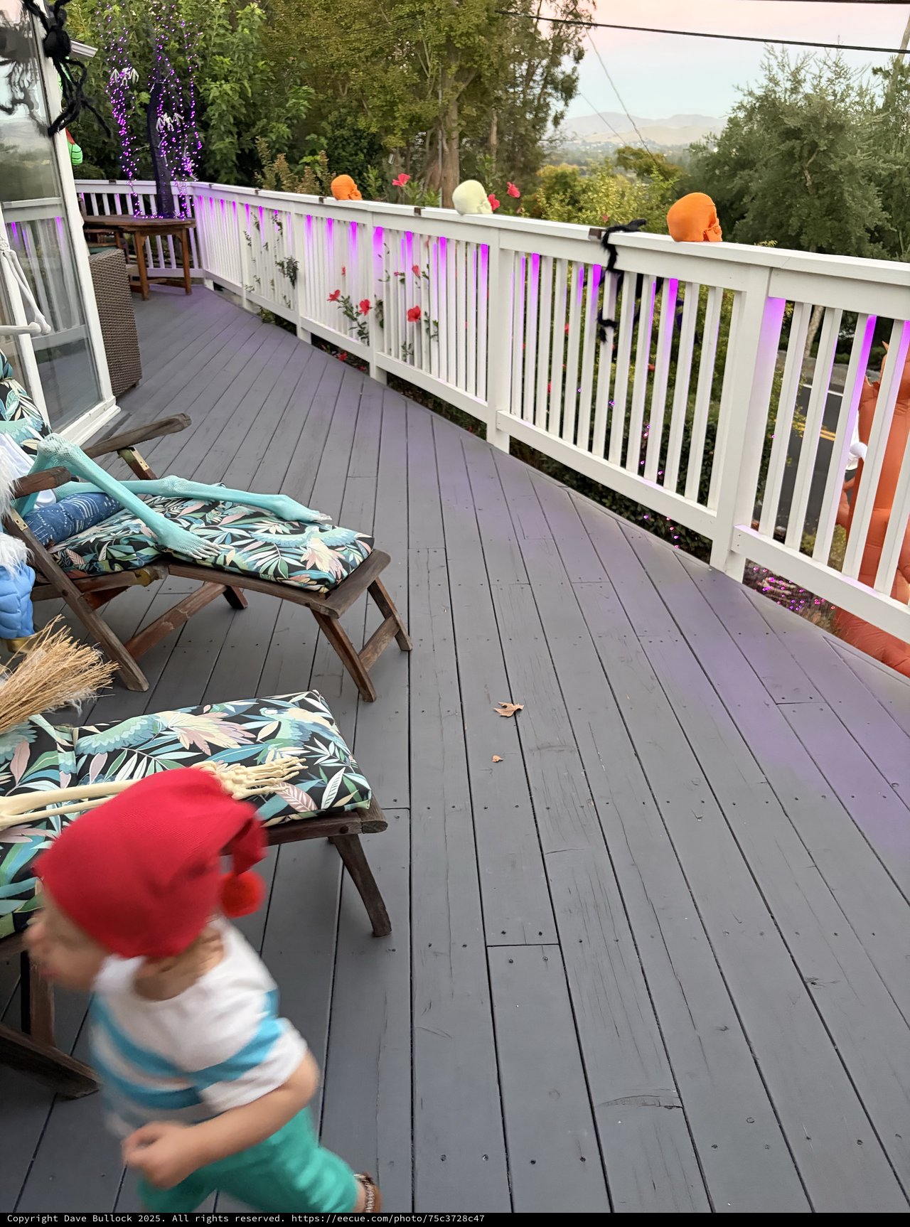Child in Motion on Decorated Hillside Deck