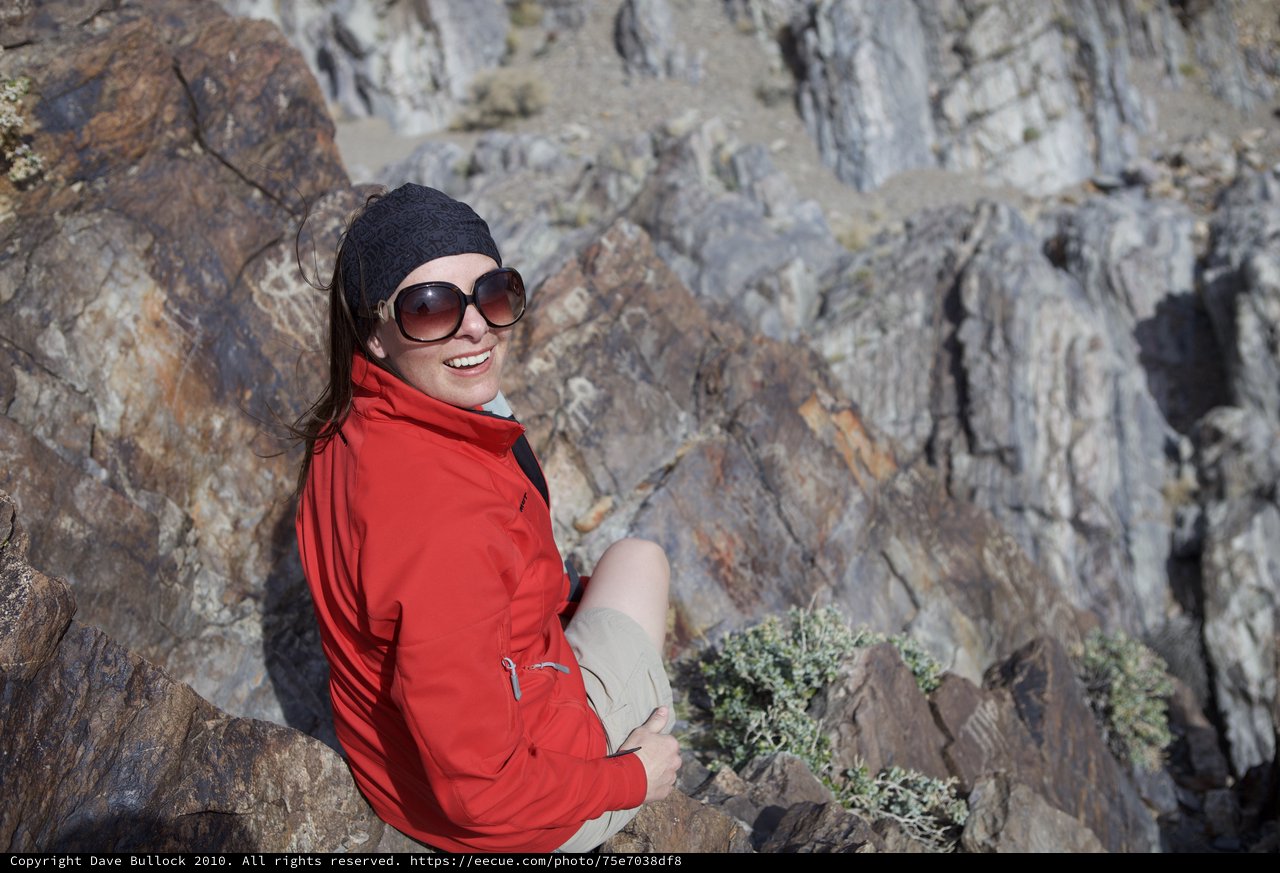 Smiling Hiker Resting on Rocky Canyon Ledge