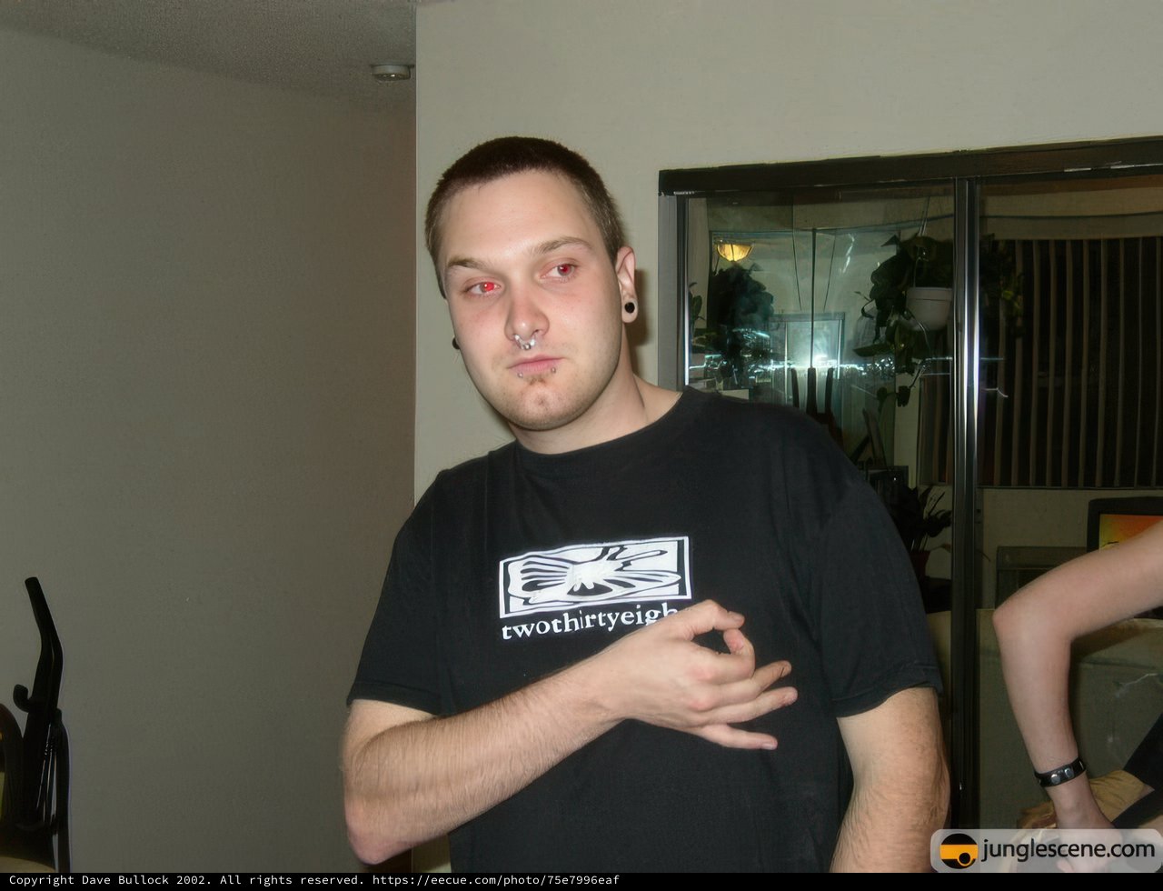 Man in Black Shirt Poses for Portrait