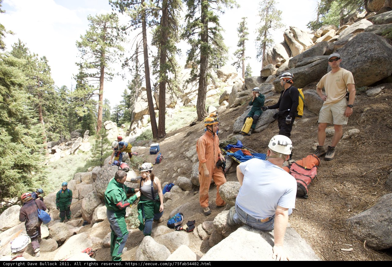 Scaling New Heights: Hikers Conquer Rocky Hillside