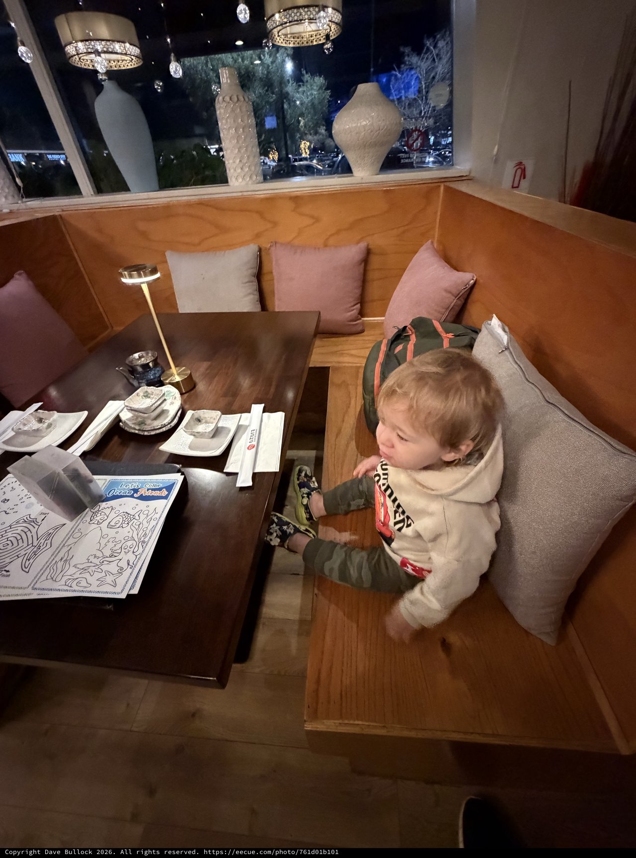 Young Child Dining at Upscale Restaurant Booth