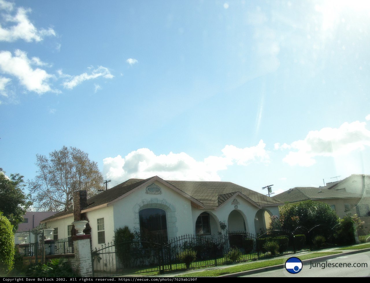 Large Hacienda-Style House with Grand Front Lawn