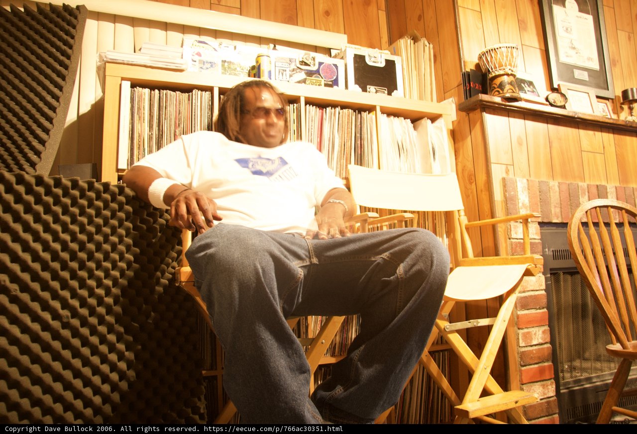 A Man Contemplates in a Plywood Chair