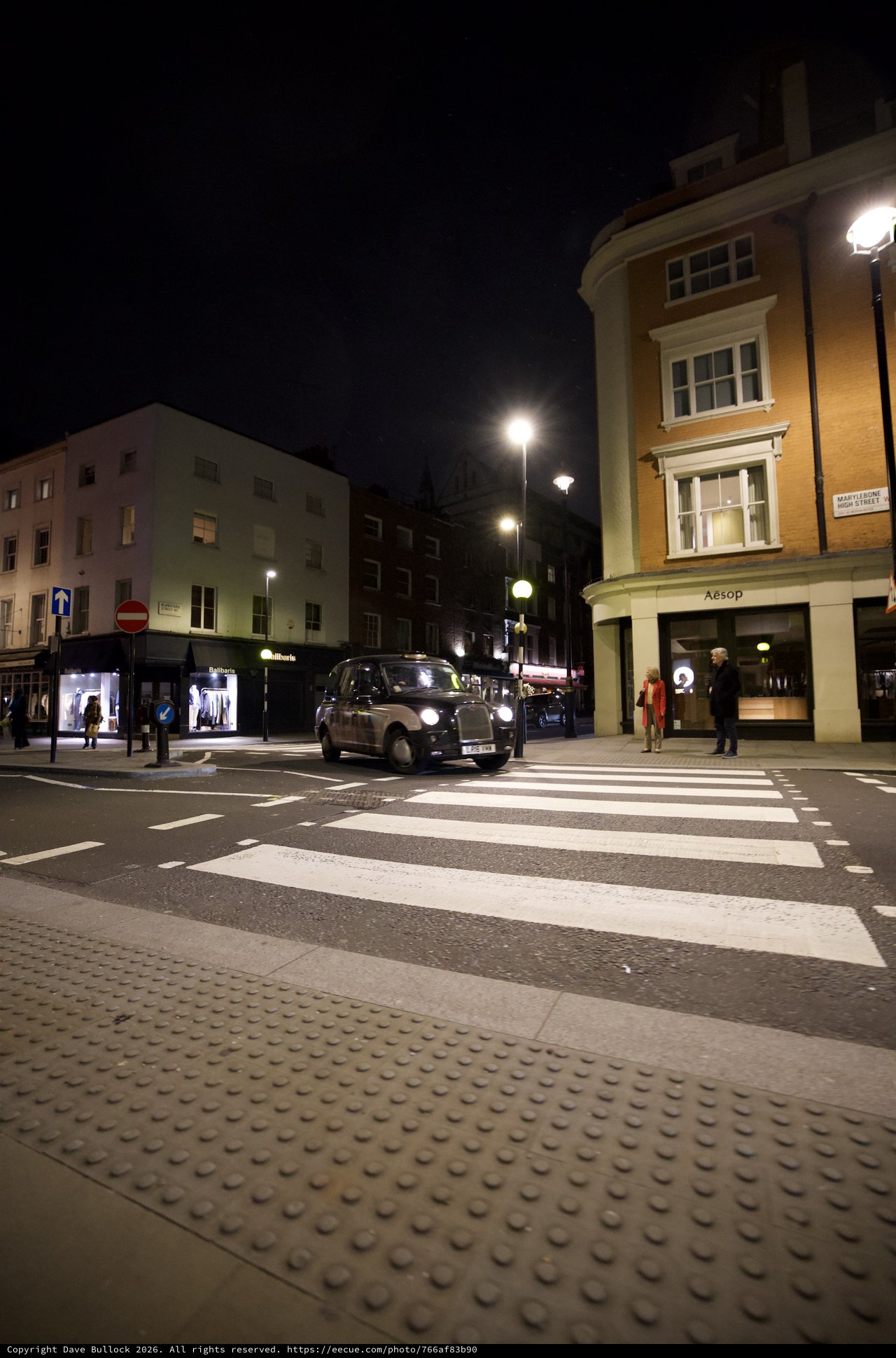 London Black Cab at Night Zebra Crossing