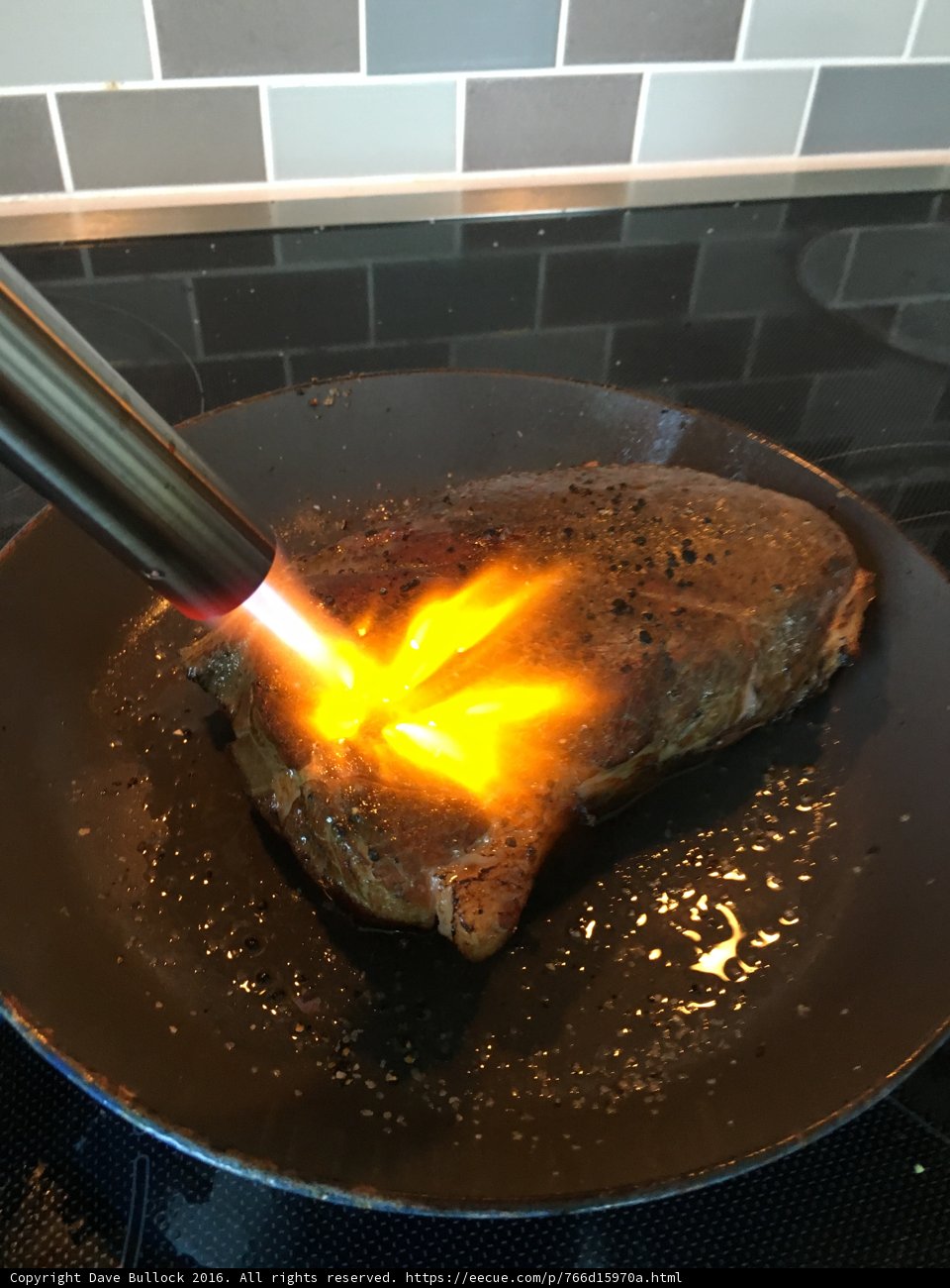Flame-grilled Steak on a Cooking Pan