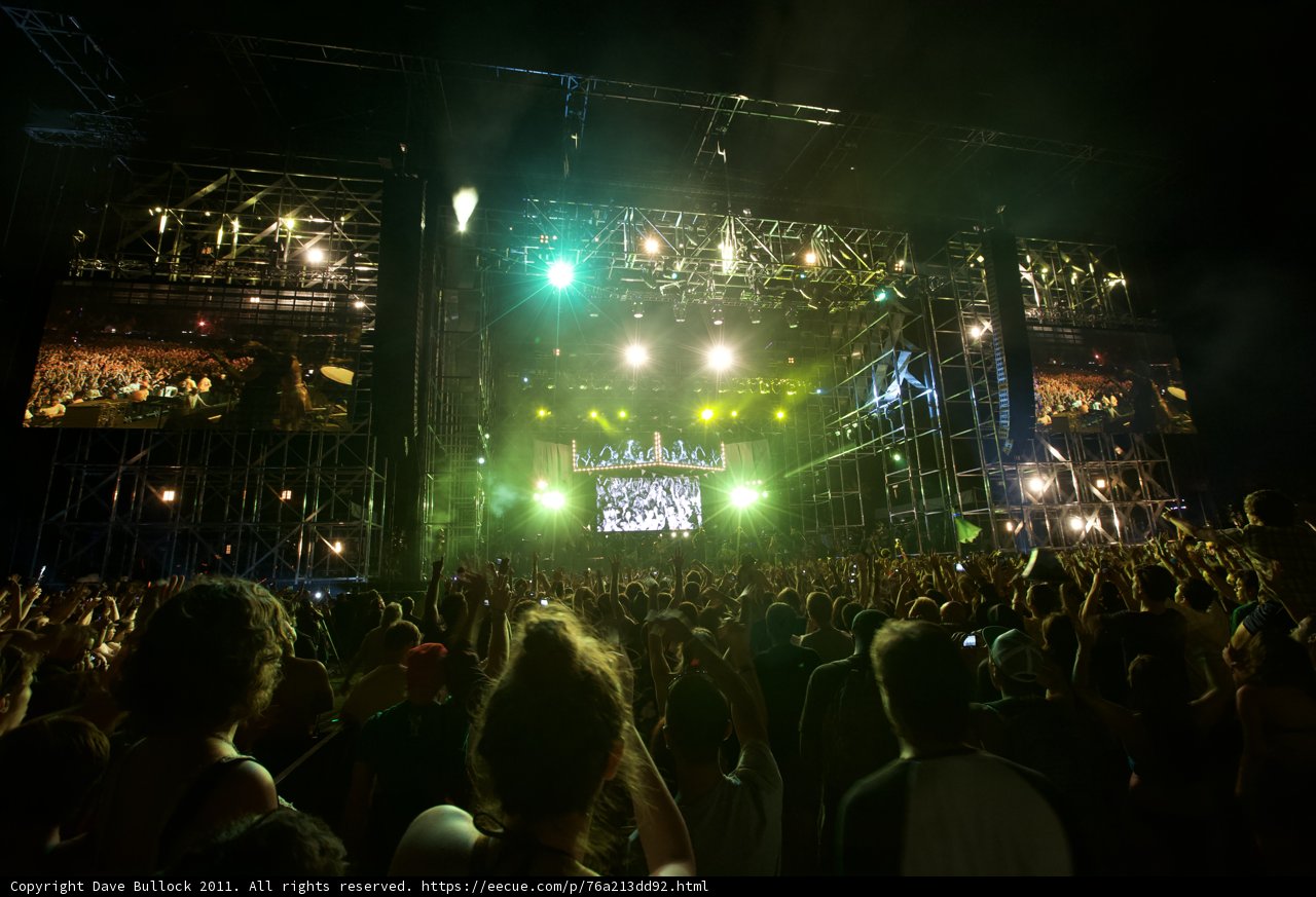 Green Spotlight on Rock Concert Crowd