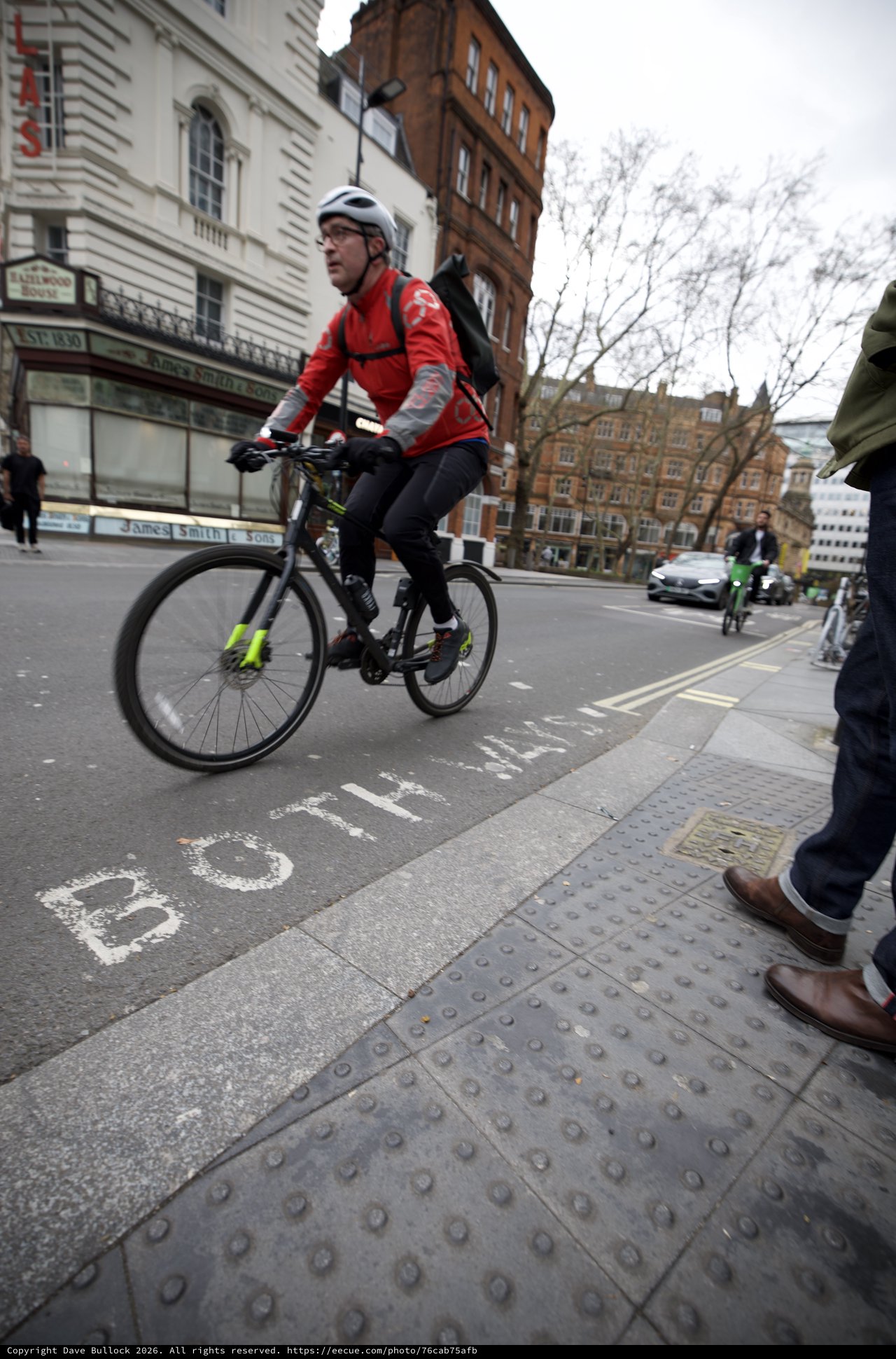 Urban Cyclist Navigating London City Streets