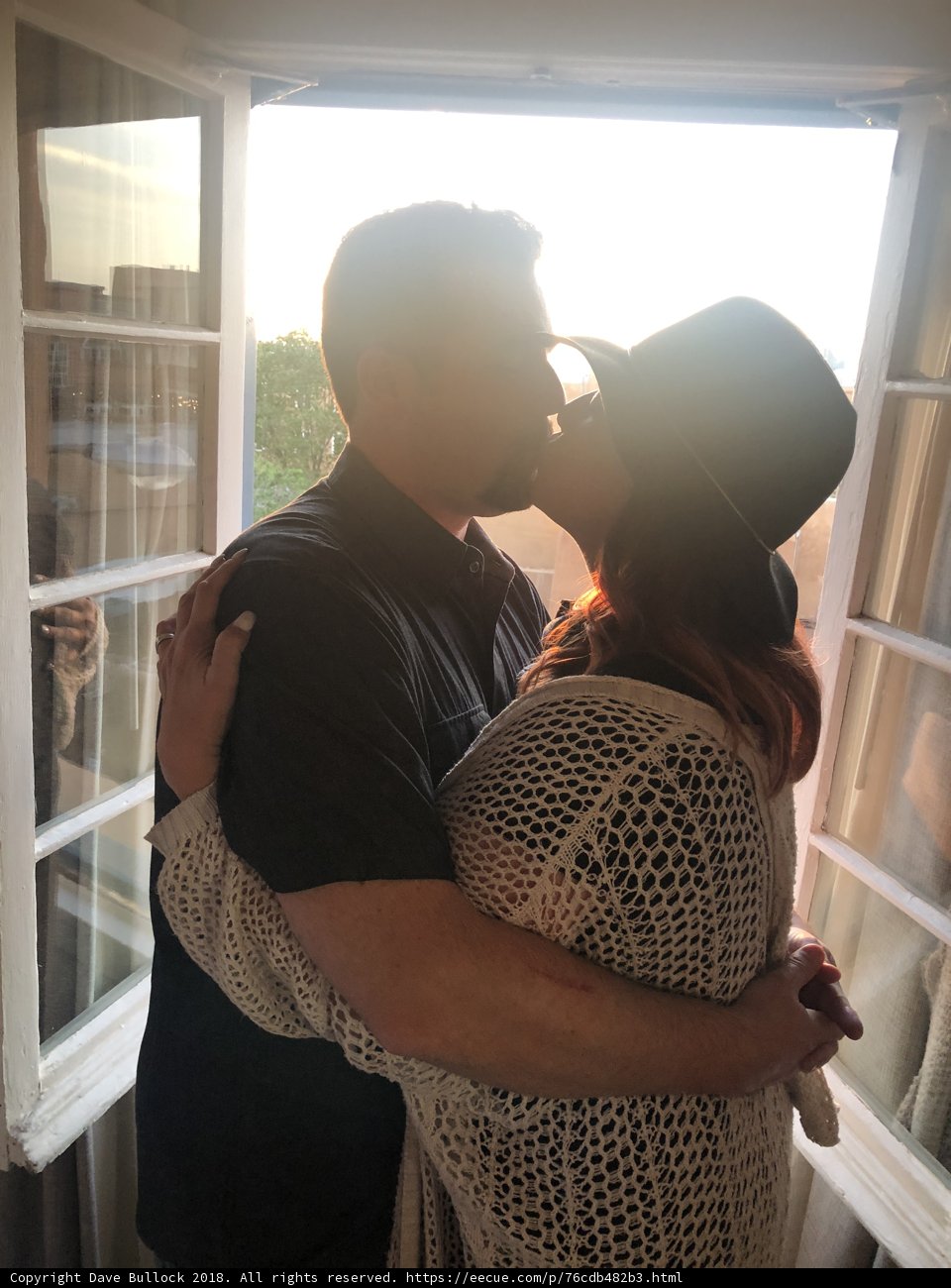 A Romantic Moment in Front of the Window