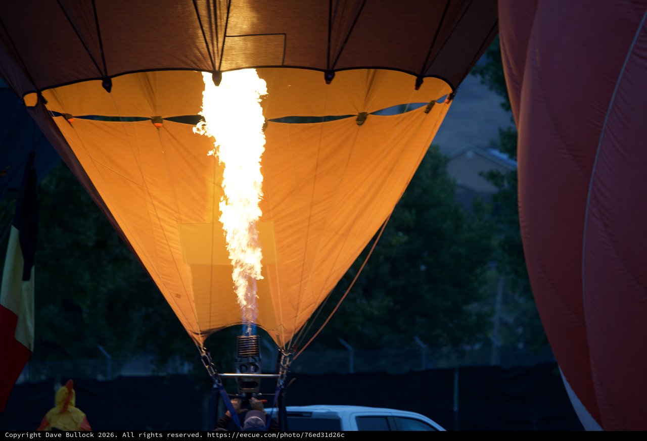 Inferno Within: Hot Air Balloon Inflation at Dawn