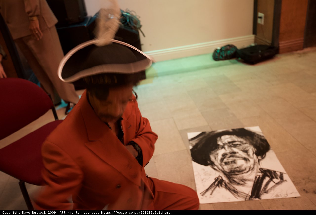 The Red Suit Man on the Wooden Floor