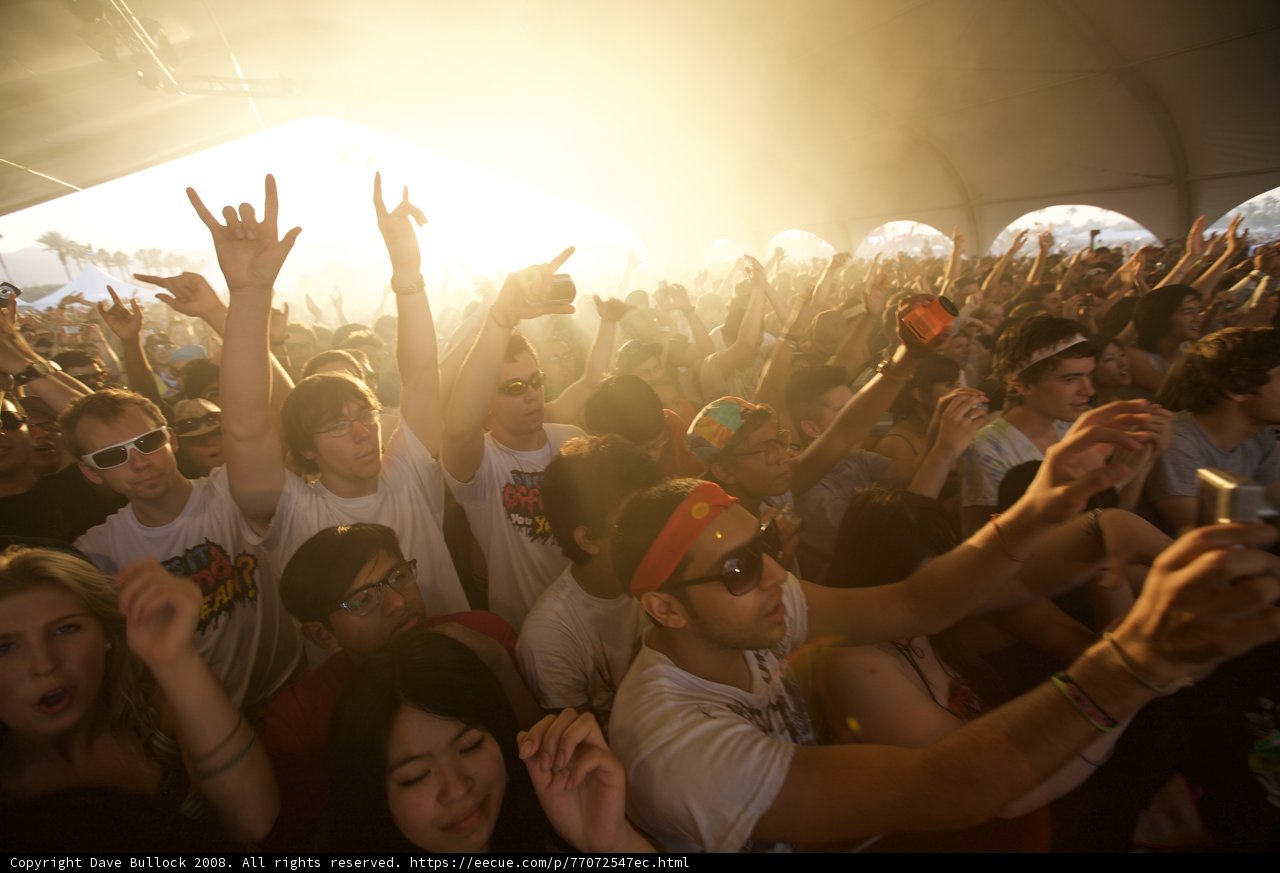 Coachella Concert-goers Raise Hands in Excitement