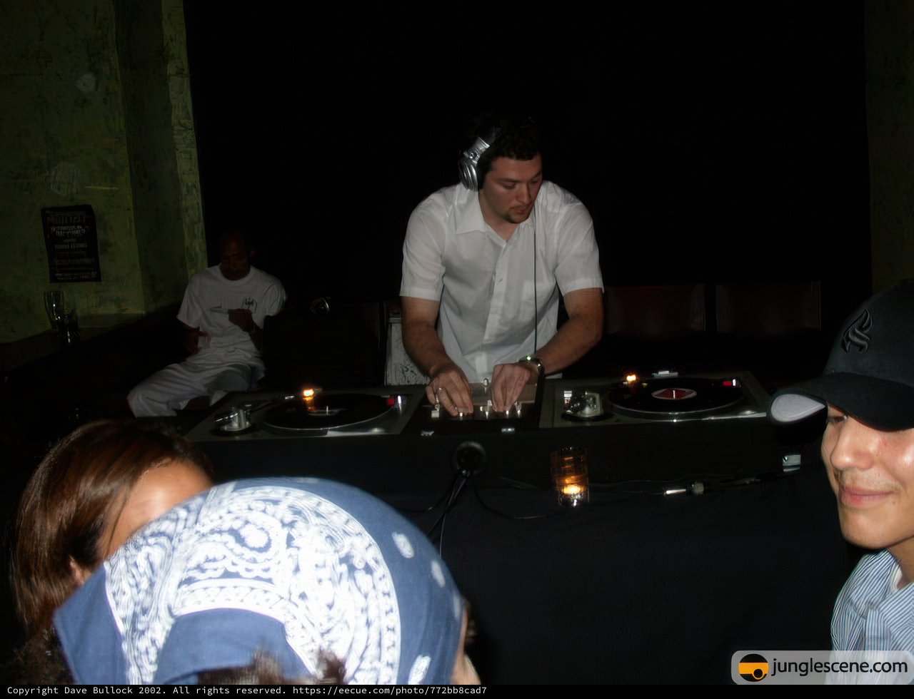 DJ spinning tracks in urban nightclub