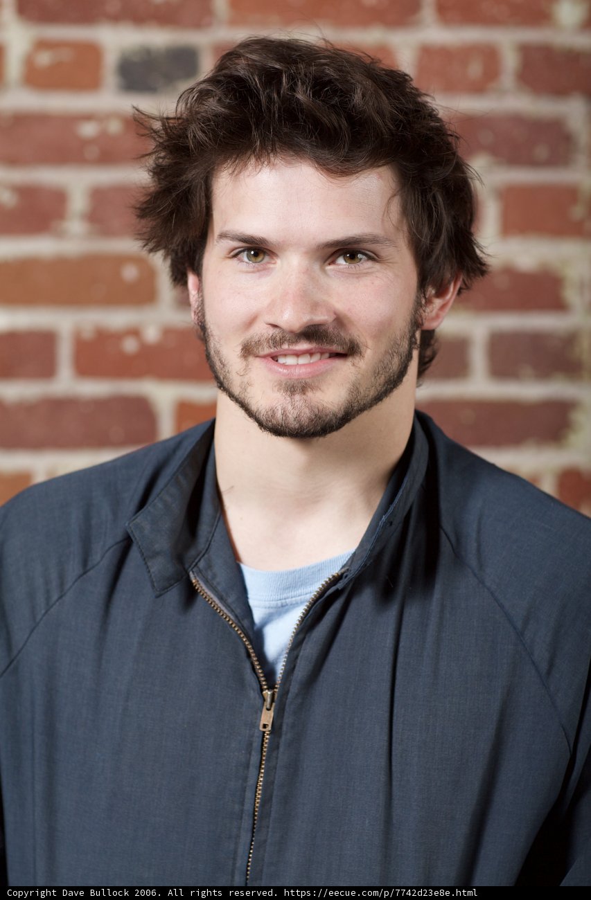 The Smiling Bearded Man in Blue