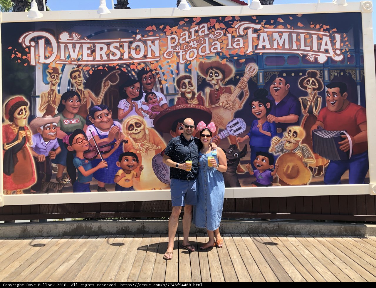 Couple Posing in Front of Family Mural
