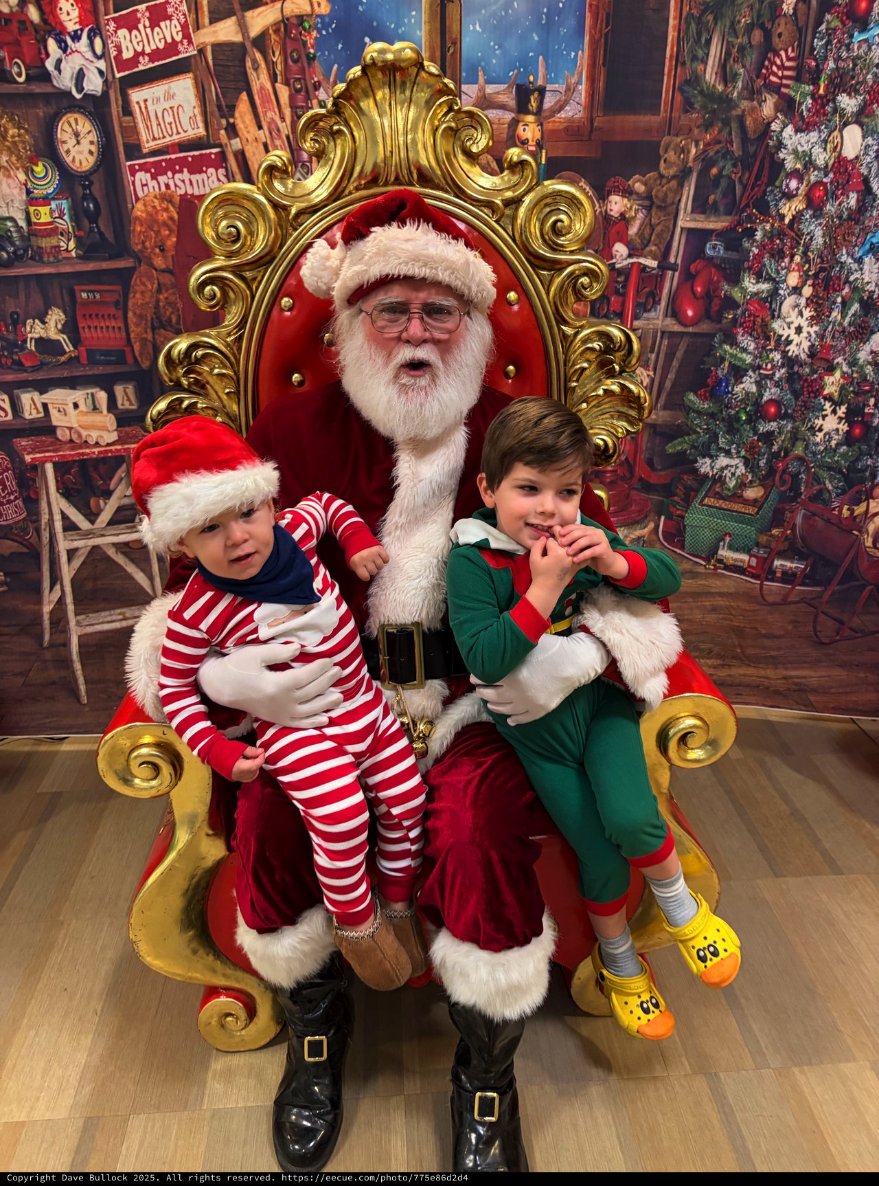 Two Children Visit Santa in His Ornate Golden Throne