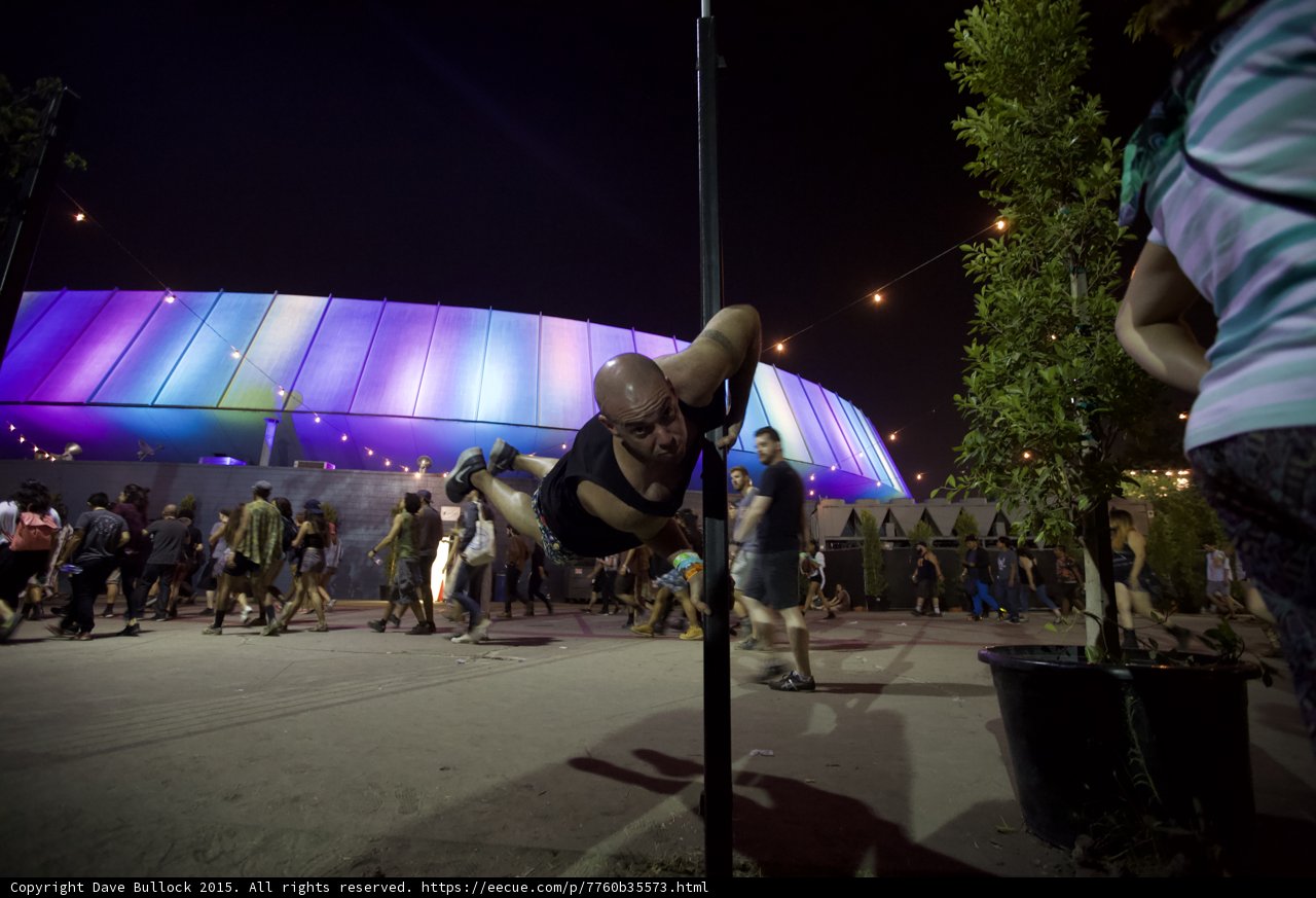 FYF Fest Bald Man Pole Trick LA Sports Arena Rainbow Lights Potted Plant Crowd Night