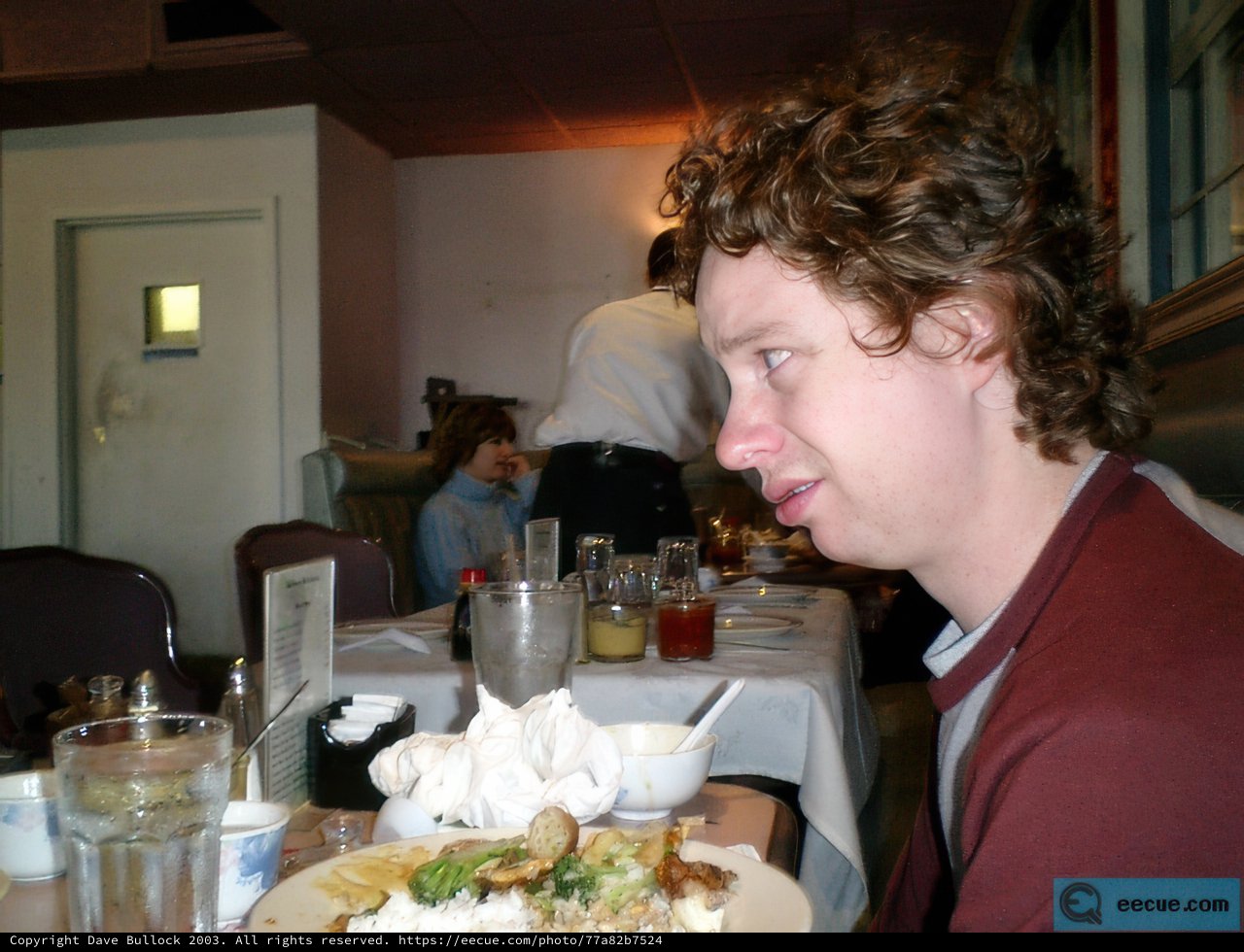 A Trio Dining in a Cozy Restaurant