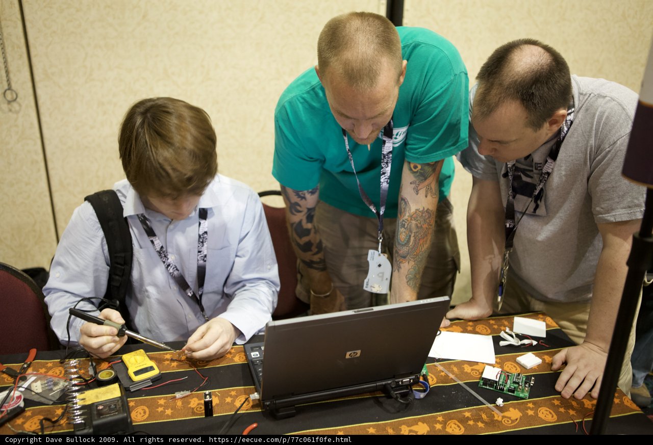 Laptop Discussion Among Men