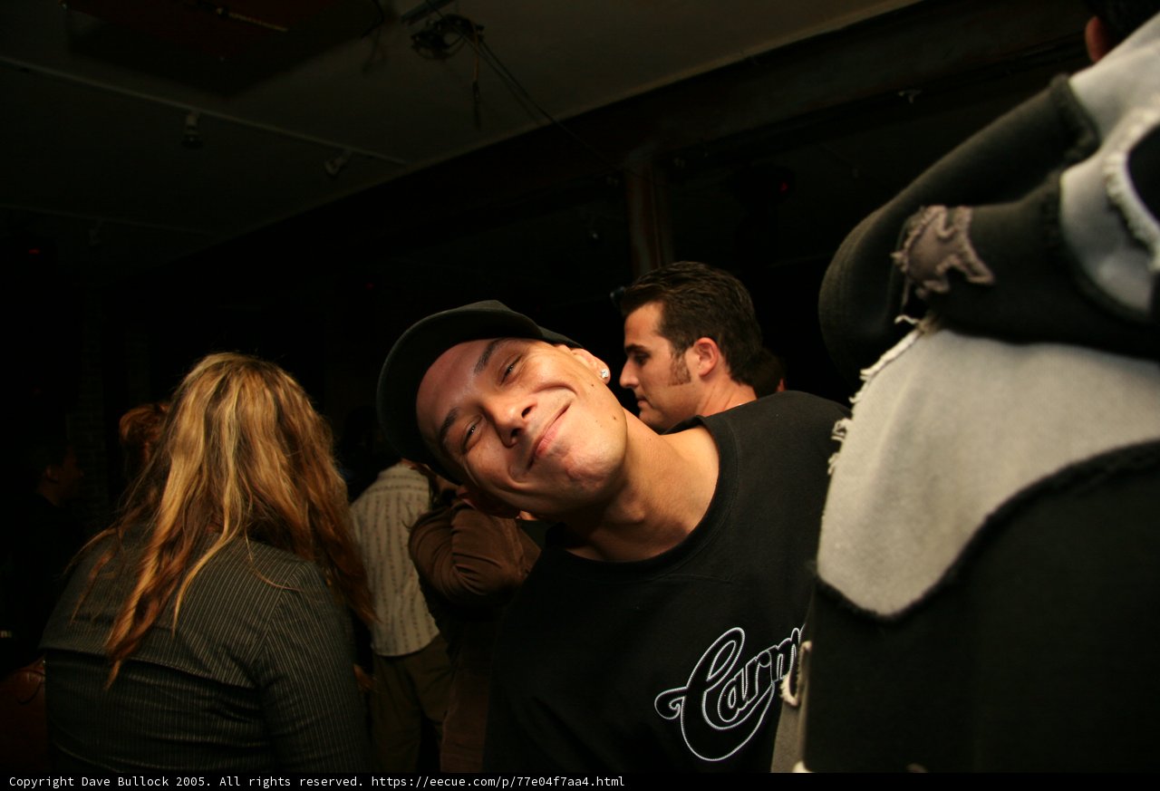 Stylish DJ S in Black T-Shirt and Baseball Cap