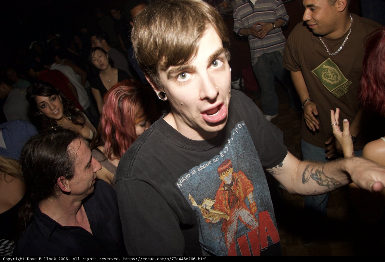 Tattooed Man in Black T-Shirt