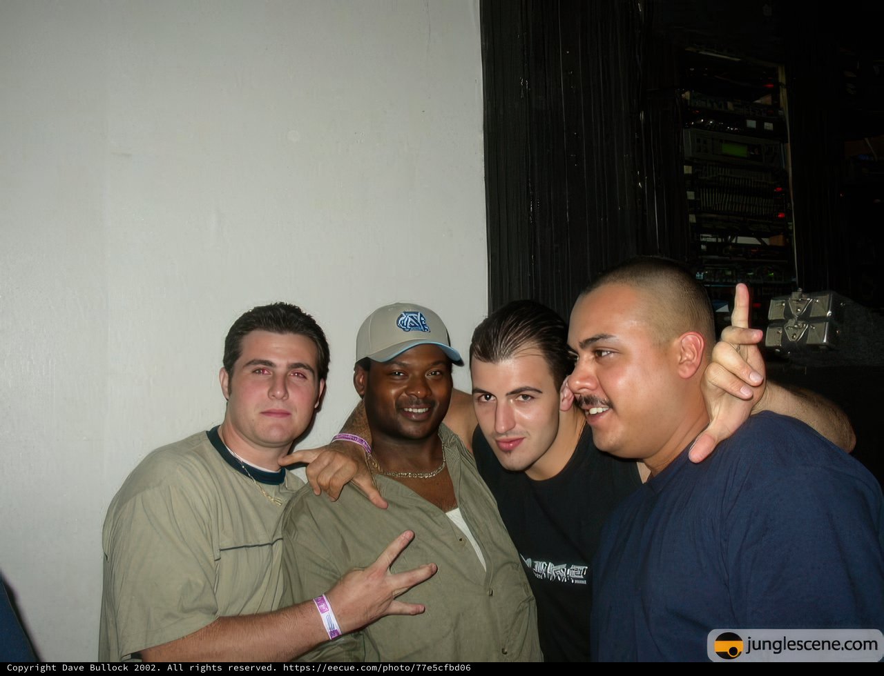 Four Men Strike a Pose at Party
