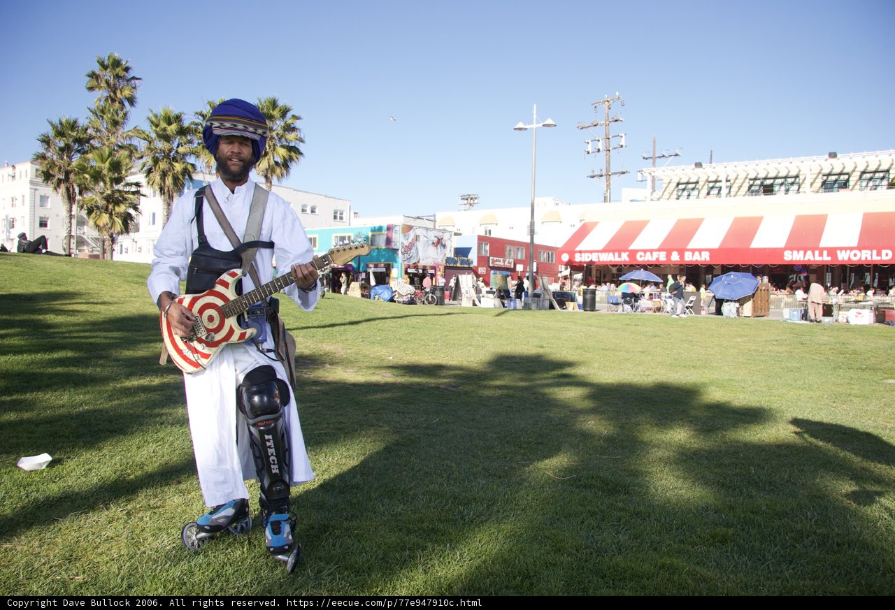 Helmeted Guitarist Serenades Crowd at Outdoor Concert