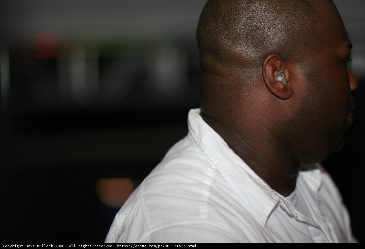 White Shirt and Earbuds