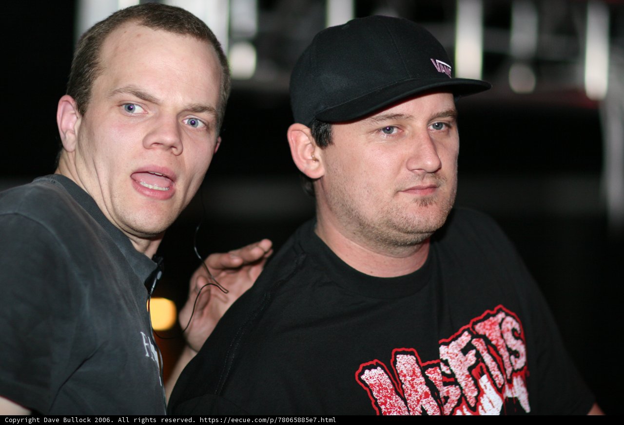 Two Men Sporting Matching Baseball Caps