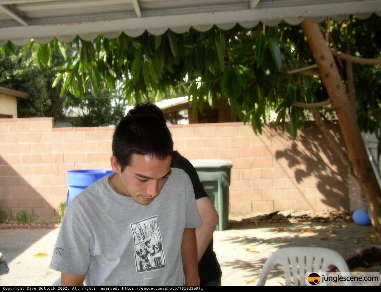 Backyard portrait of two teenage boys