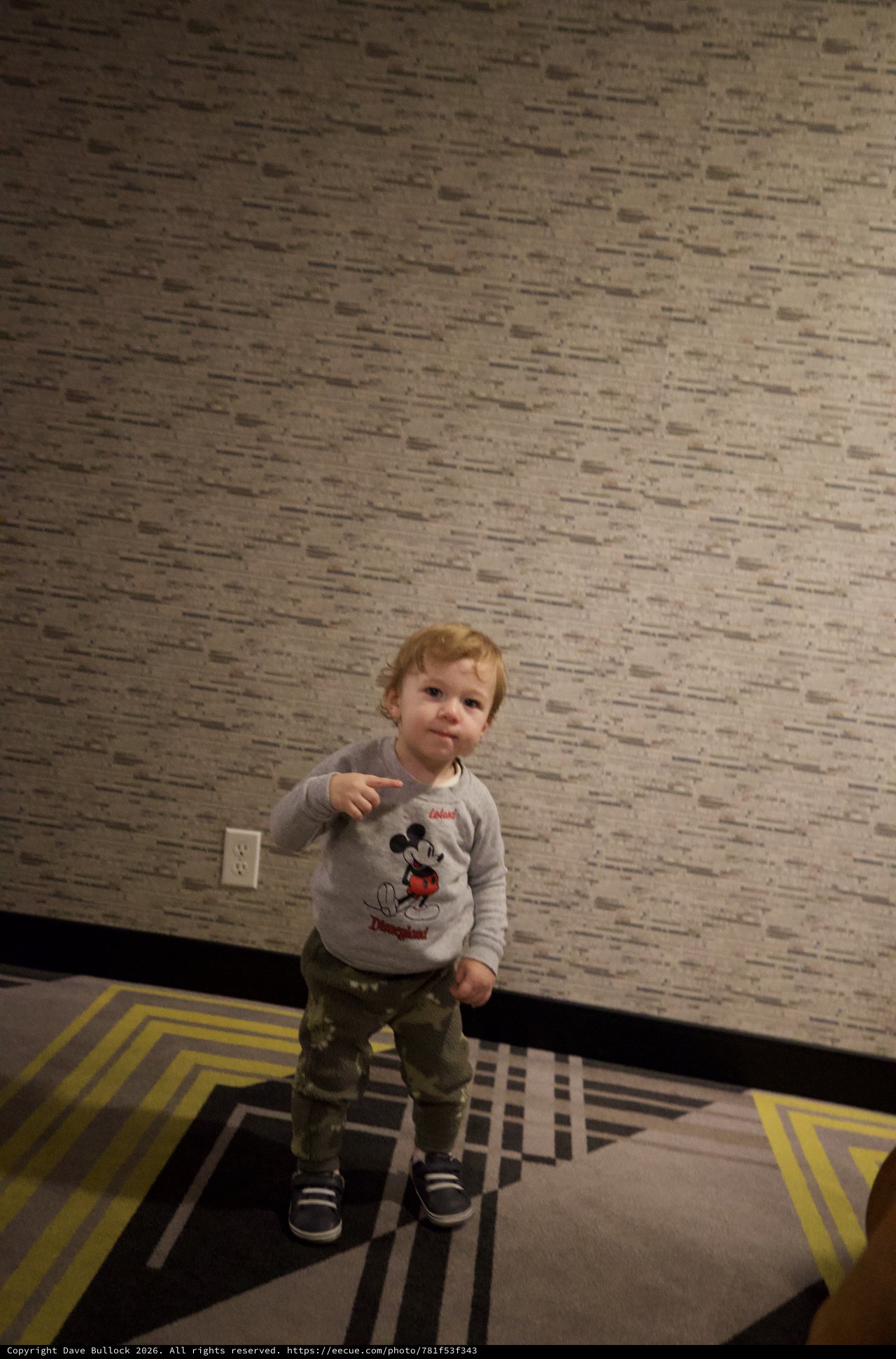 Toddler in Mickey Mouse Sweatshirt at Hotel