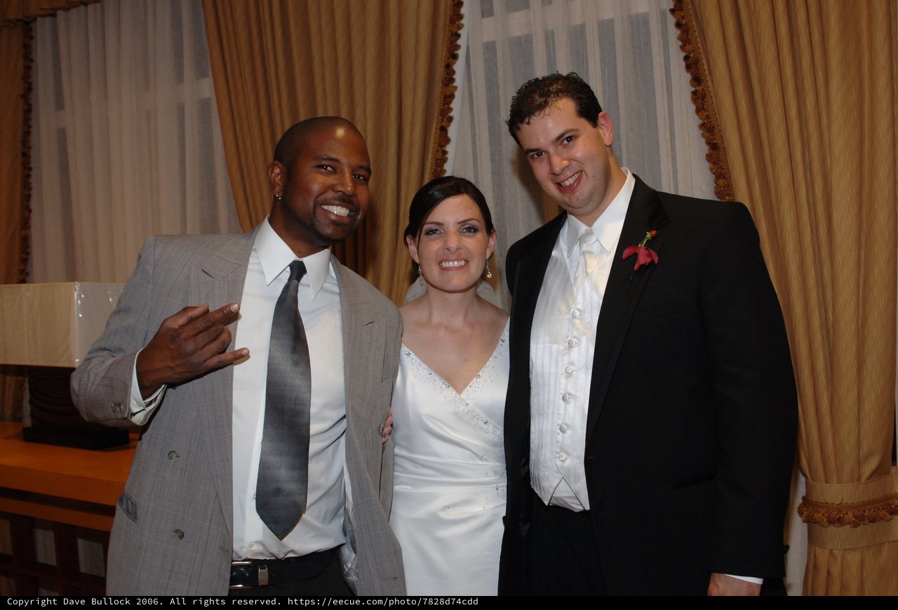 Joyful Wedding Celebration with Bride, Groom, and Guest