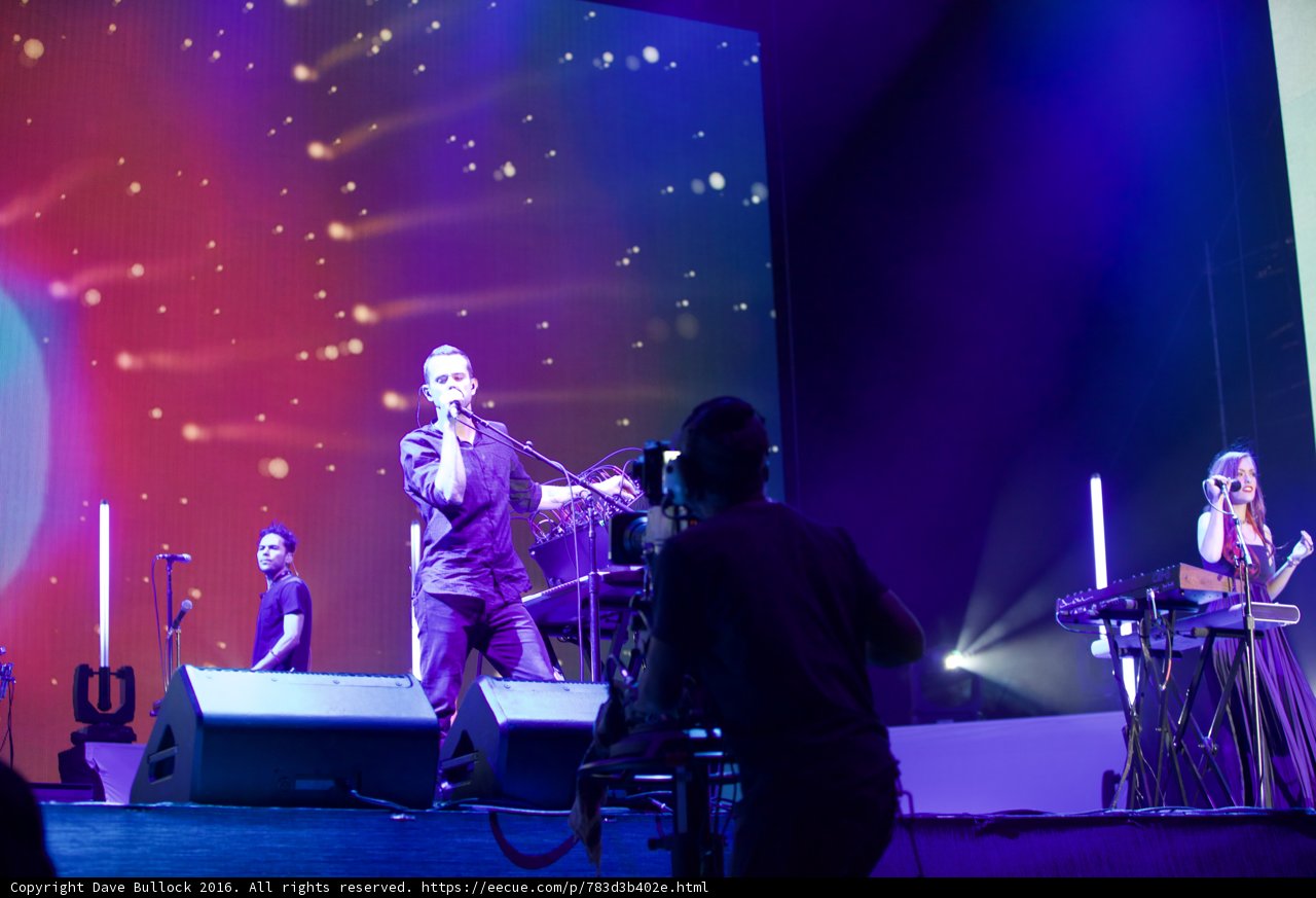 Entertainer on Stage with a Music Band