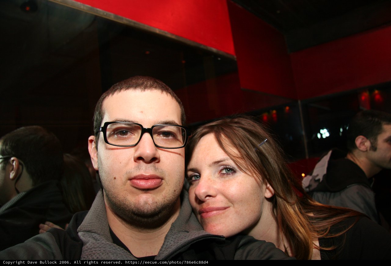 Two Friends Posing Together at a Nightclub