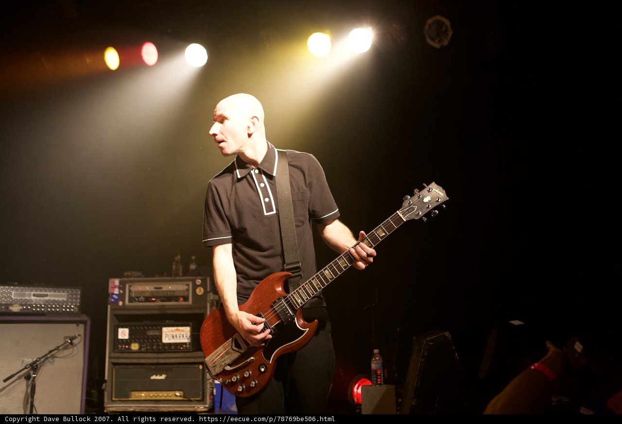 Man in black shirt rocks out on electric guitar