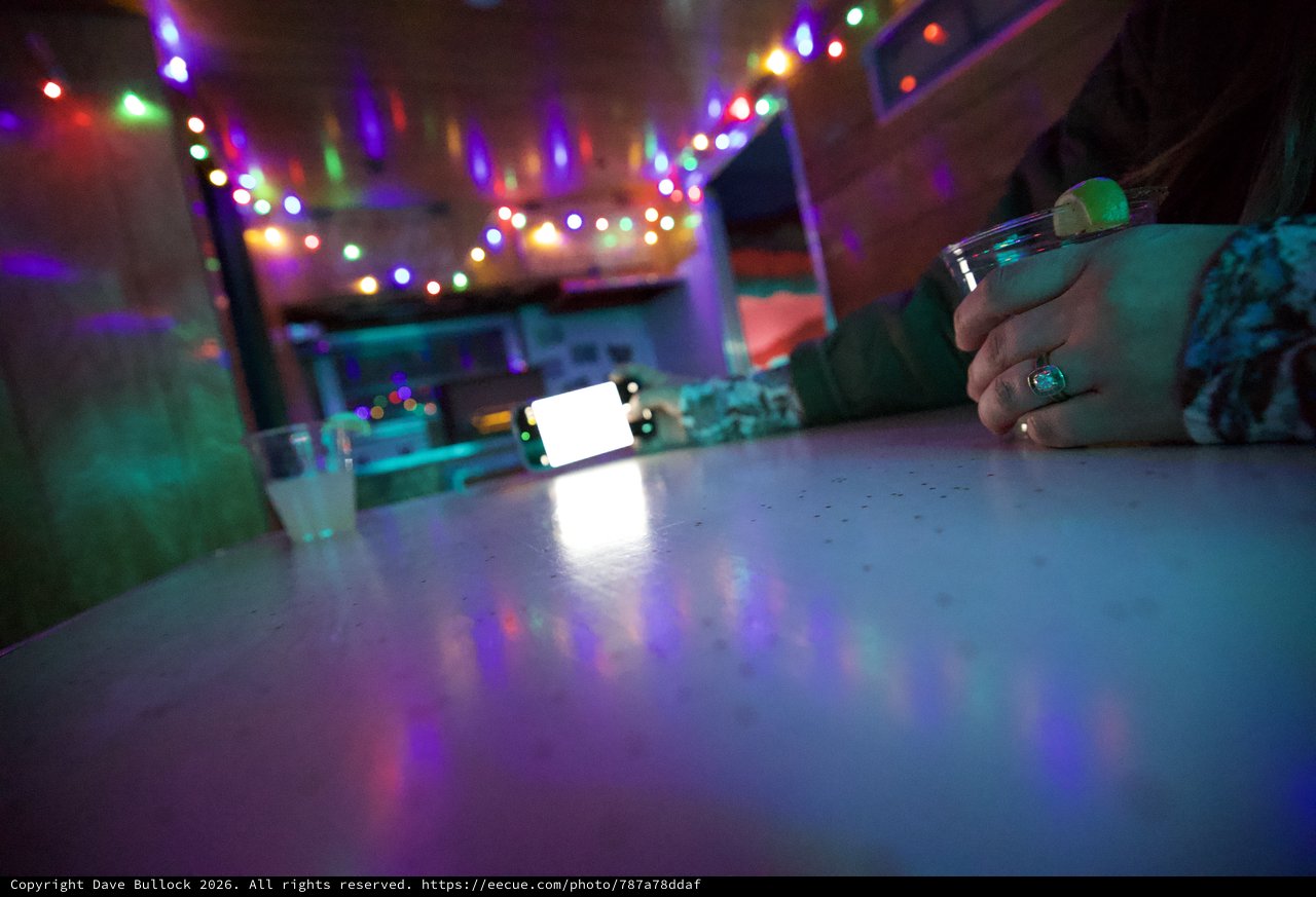 Festive Evening at a Colorfully Lit Bar