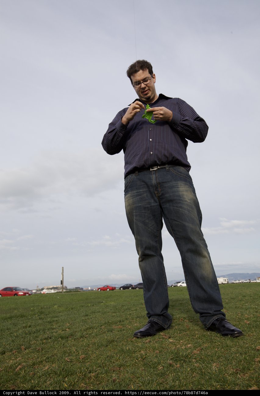 Kite flying in the cloudy fields