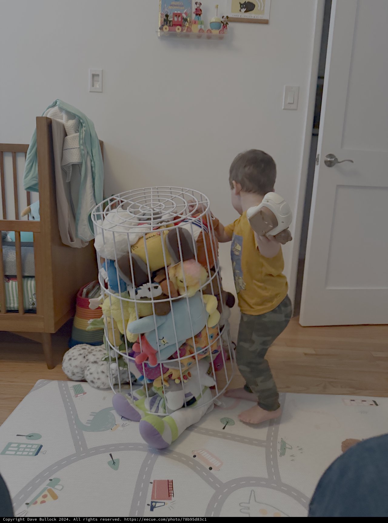 Toddler Playing with Colorful Toy Storage Basket