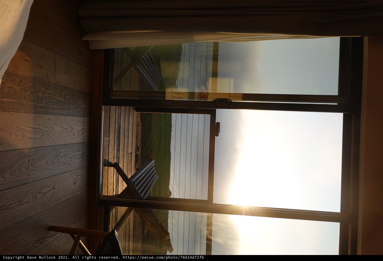 Sunrise Ocean View Through Glass Doors