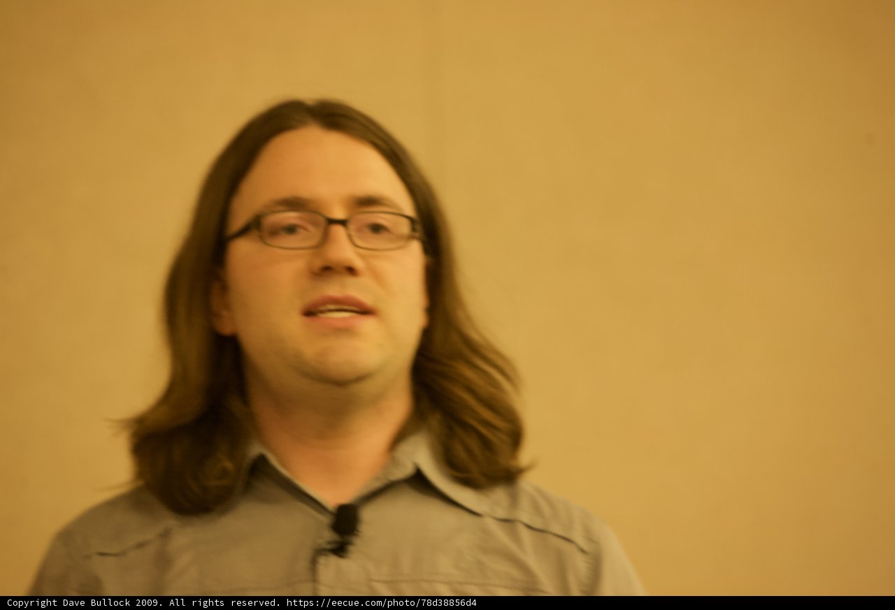 Long-Haired Glasses Wearer Strikes a Pose