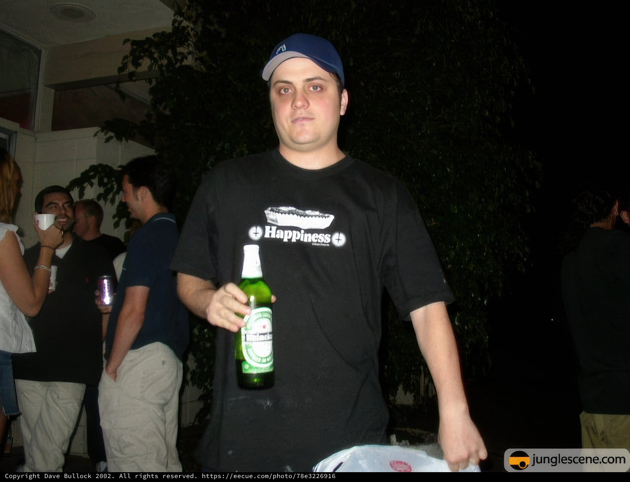 Man Enjoying a Cold Beer with Friends