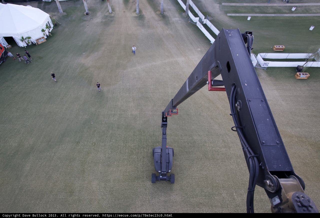 Aerial Crane Lift Over Busy Airfield