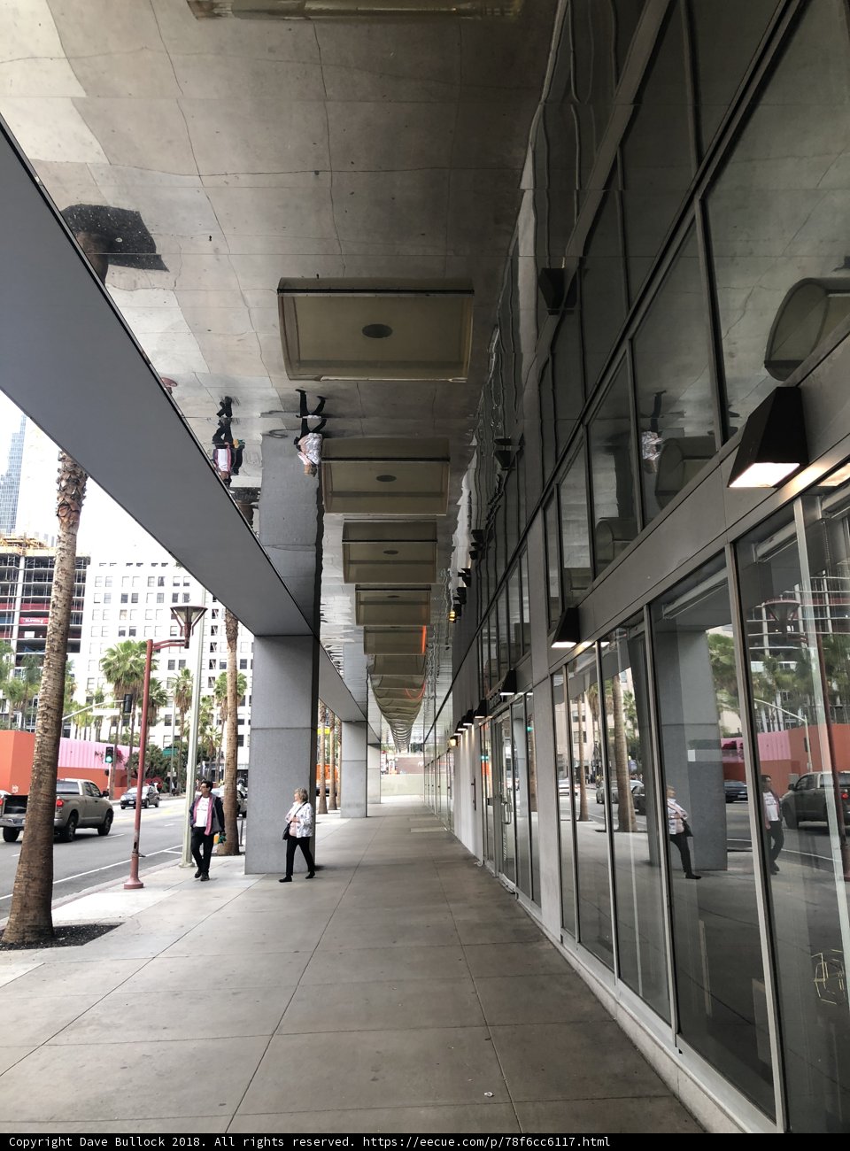 Urban Pathway Filled with People and Cars