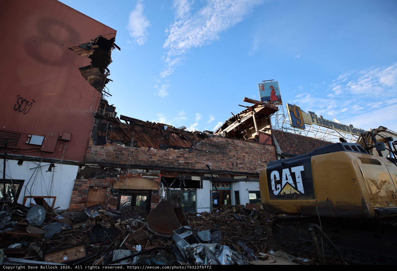 Tornado Destruction Site with CAT Excavator and Debris