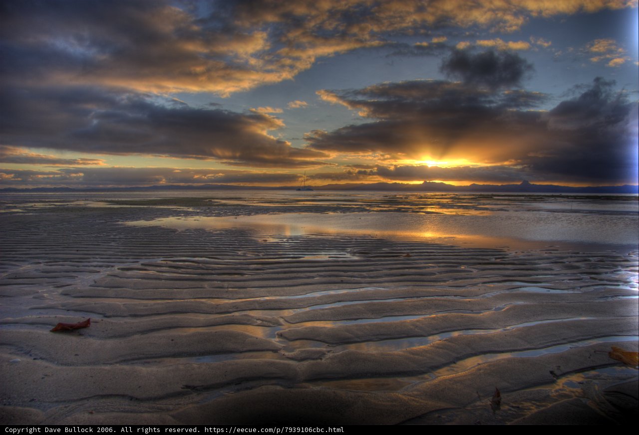 Majestic Sunset Over the Cloudy Beach
